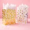 6 Packs: 13 ct. (78 total) Medium Gold & White Polka Dot Gift Bag Value Pack by Celebrate It™